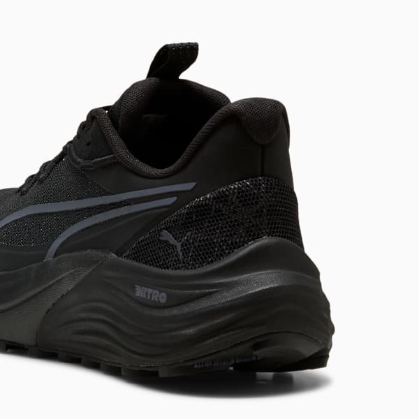 Black PUMA running trainers for adults, featuring NITRO branding on the textured sole.