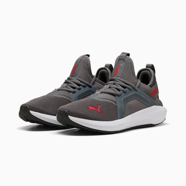 Grey PUMA trainers for adults with red logo accents and lace-up fastening.