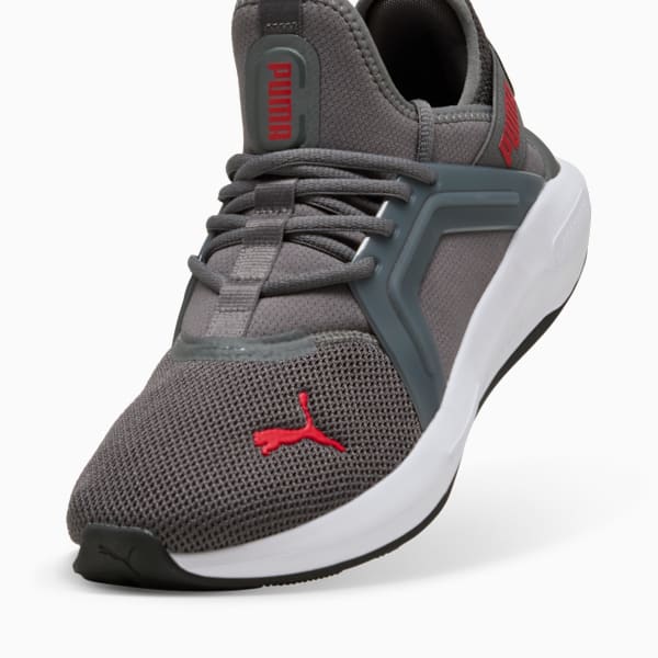 Grey PUMA trainers for adults, with red logos and lace-up fastening.