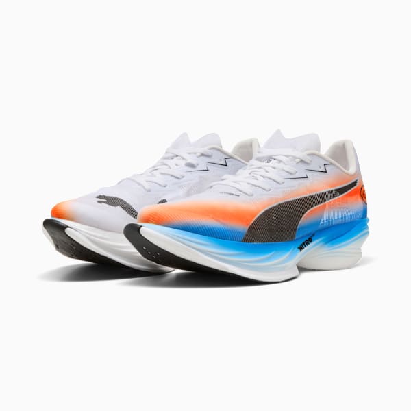 White PUMA running trainers with orange, blue, and black detailing for adults.