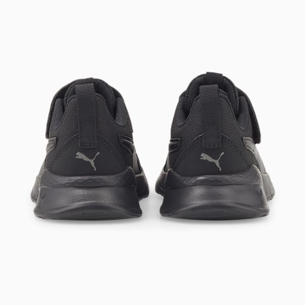 Black PUMA trainers (child) with touch-fastening straps and logo on the heel.