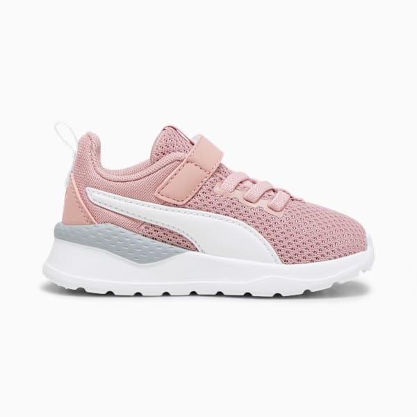 Pink PUMA toddler shoe with a white formstrip and strap closure.