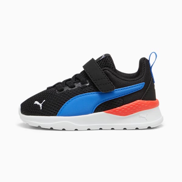 Black PUMA trainer for kids with blue and coral details and a fastening strap.