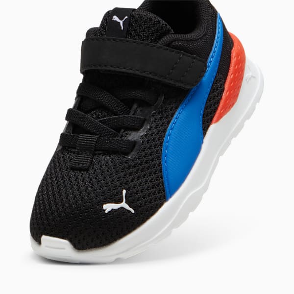 Black PUMA trainer for toddlers with laces, hook-and-loop strap, blue and orange accents.