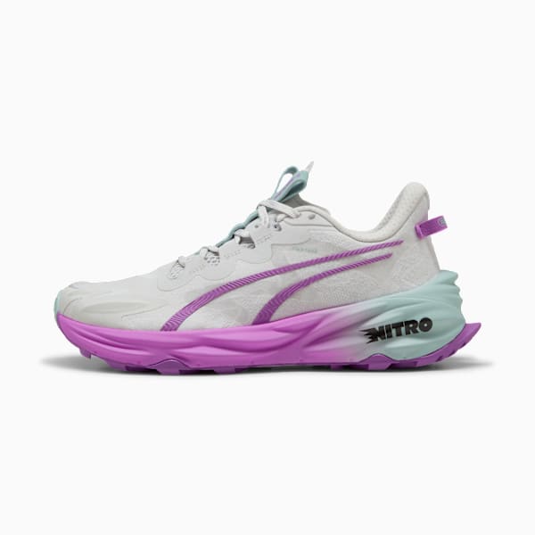 White PUMA running shoe with purple formstrip and textured purple and teal sole.