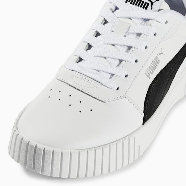 White PUMA trainer with black stripe and lace-up closure for women.