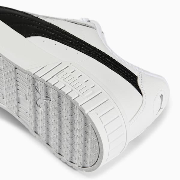 White PUMA trainer, for adults, with a textured grey sole and black stripe.