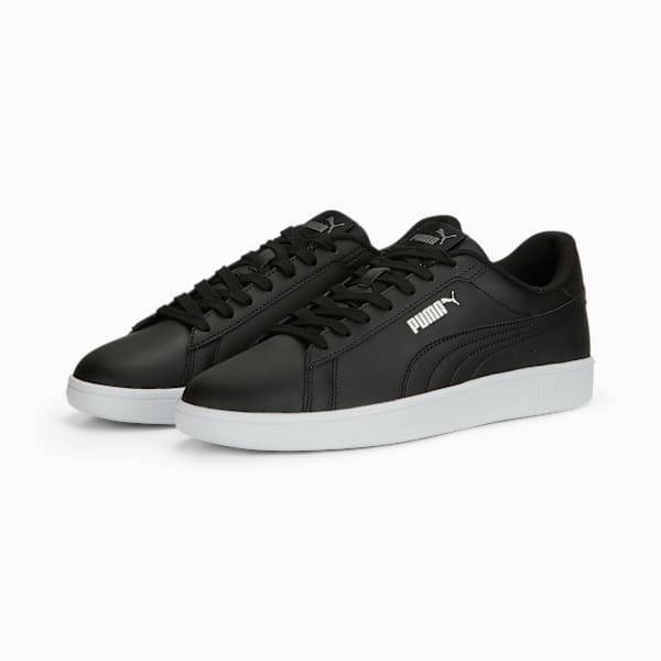 Black PUMA trainers for adults with a white sole and the PUMA logo on the side.