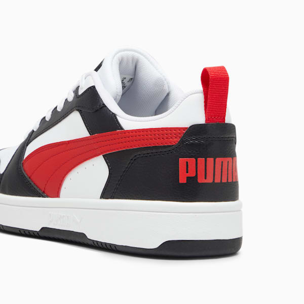 White, black and red PUMA trainer featuring a bold side stripe and heel pull tab.