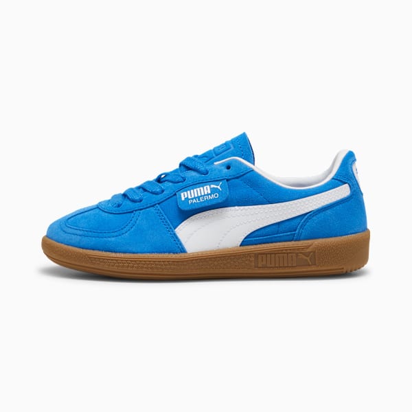 Blue PUMA Palermo trainers with white stripes and a brown sole for adults.