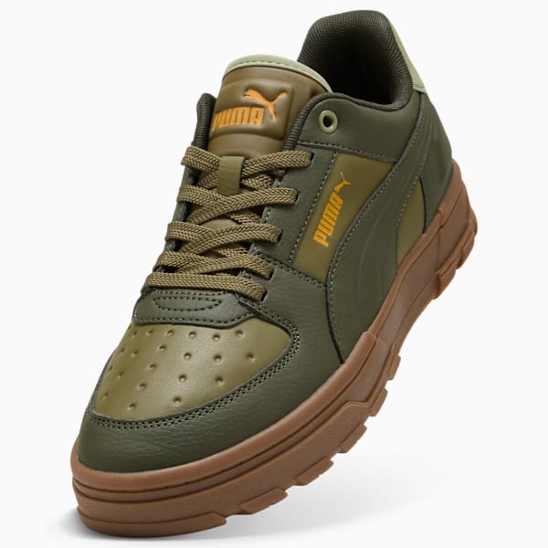 Olive PUMA trainers feature laces and a brown ridged sole for men.