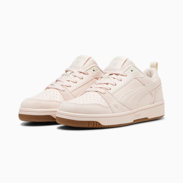 Pink PUMA trainers for women with suede and leather-like upper and brown sole.