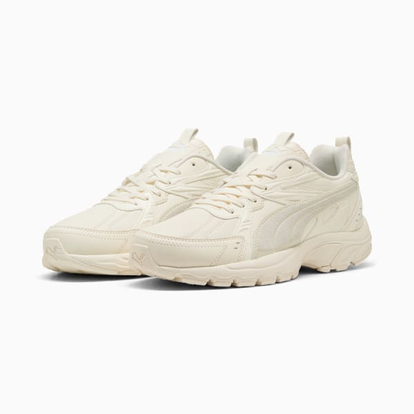 Cream PUMA trainers for adults with a lace-up design and chunky sole.
