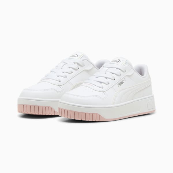 White PUMA trainers for girls, with a lace-up design and platform sole.