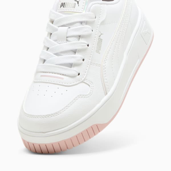 White PUMA trainer with lace-up closure and a pink accented sole.