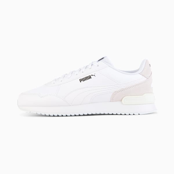 White PUMA trainer with suede accents and a ridged sole for grip.