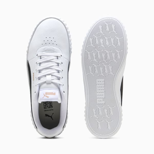 White PUMA women's trainer showing laces and patterned sole.