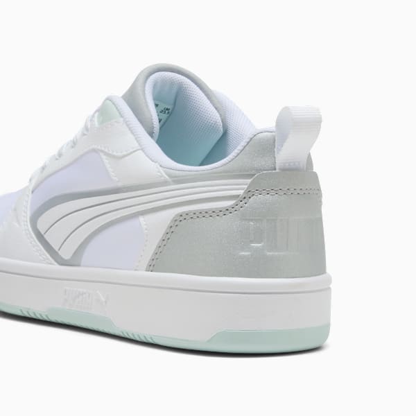 White PUMA trainers for adults, featuring silver accents and a heel pull tab.