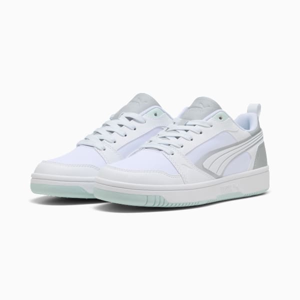 White PUMA trainers with lace-up closure and signature stripe detail.