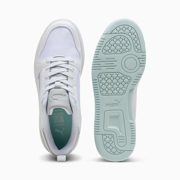 White PUMA ladies' trainer with lace-up closure and patterned sole.