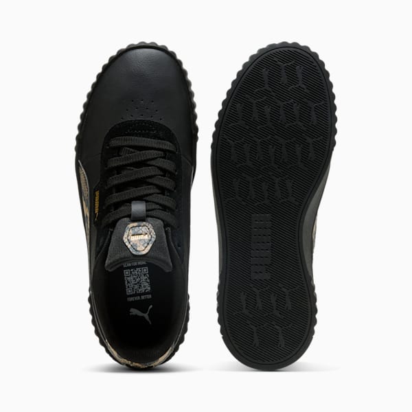 Black PUMA women's trainer showing lace-up closure and detailed sole pattern.
