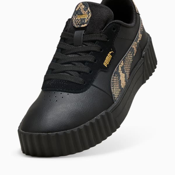 Black PUMA women's trainer with snakeskin-patterned side stripe and lace-up closure.