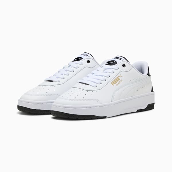 White PUMA trainers for adults, with lace-up fastening and perforated detailing.