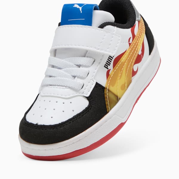 White PUMA trainer (child) with flames, laces and touch-fastening strap.