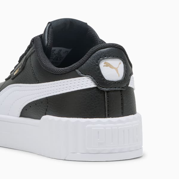 Black PUMA trainer, for adults, with white stripes and a golden logo on the heel.
