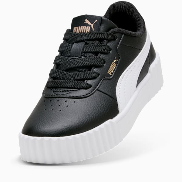 Black PUMA trainer for kids, featuring laces and a white formstrip on the side.