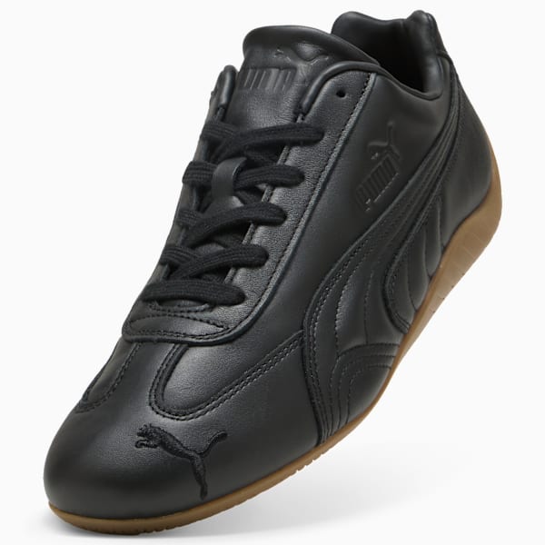 Black PUMA men's shoe with lace-up closure and a brown sole.
