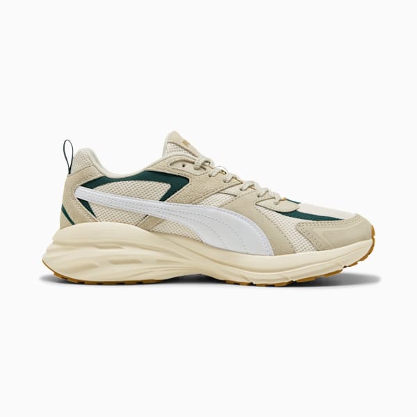 Beige PUMA unisex trainer with white formstrip and green accents on the upper.