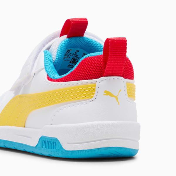 White PUMA trainer (child) with yellow stripe, and red and blue accents.