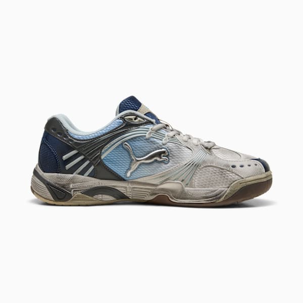 Blue PUMA trainers feature a metallic logo and a lace-up closure for adults.