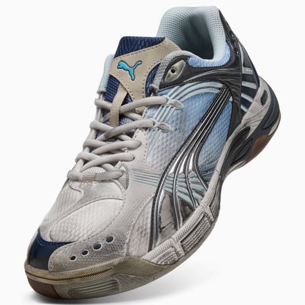 Blue PUMA trainer with a lace-up closure, and silver formstrip on the side.