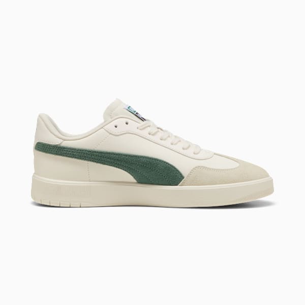 Cream PUMA unisex trainer with a green stripe and lace-up fastening.