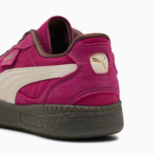 Magenta PUMA trainers with a cream stripe and gold logo on the heel.