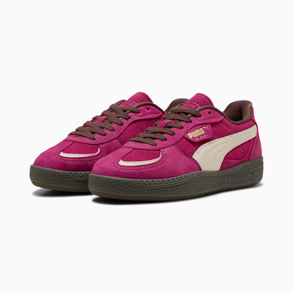 Magenta PUMA trainers with suede finish, brown laces and off-white side stripe.