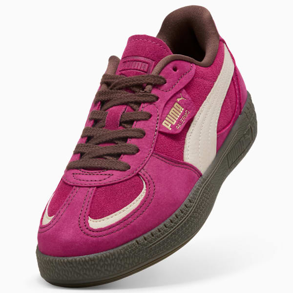 Pink PUMA Palermo trainers with brown laces and off-white side stripe.
