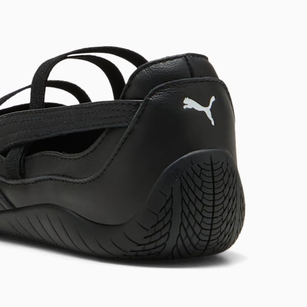 Black PUMA women's shoe with strappy design and low profile sole.