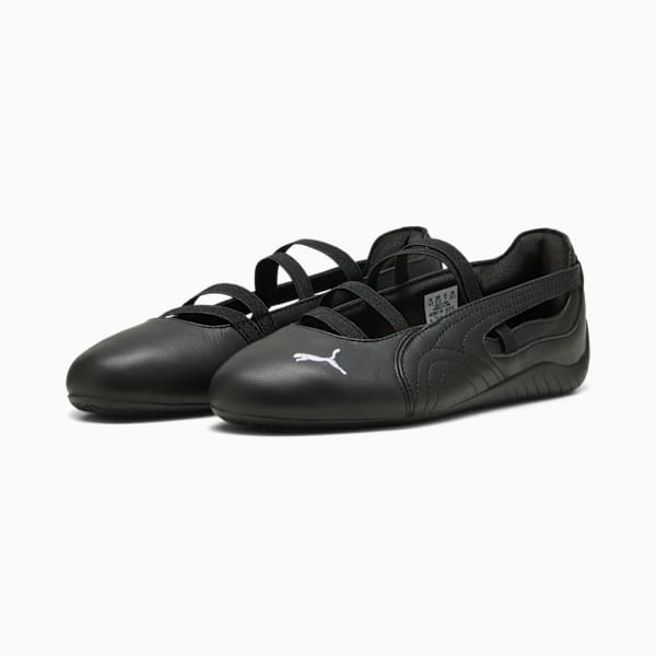 Black PUMA ballet flats for girls with elastic straps and a white logo on the side.
