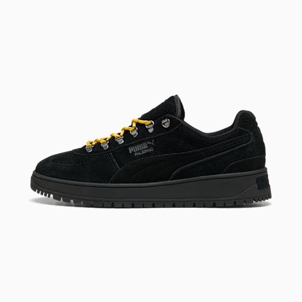 Black PUMA Palermo trainers with suede upper and yellow laced closure.