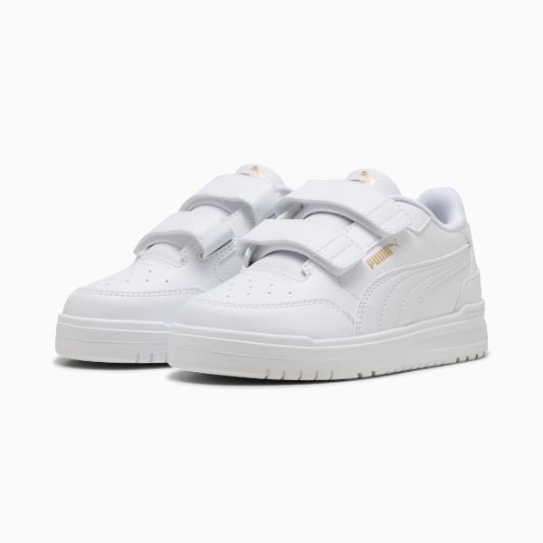 White PUMA trainers for children with two straps for fastening.