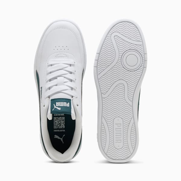 White PUMA trainer showing laces, logo and sole with grip pattern.
