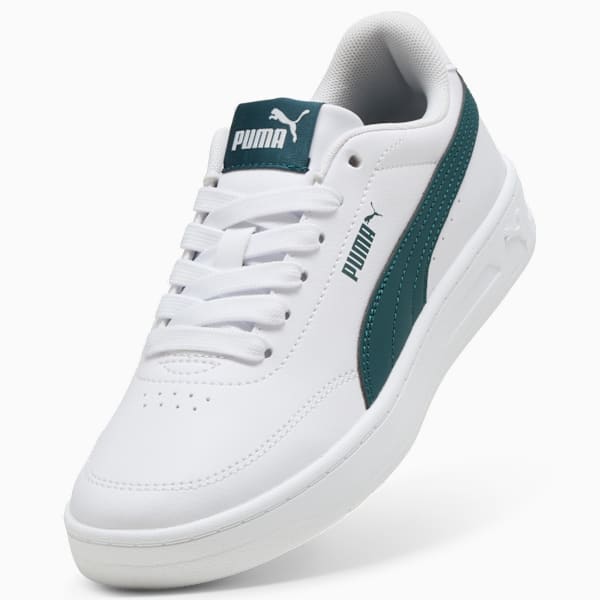 White PUMA trainer with green formstripes and logo details for adults.