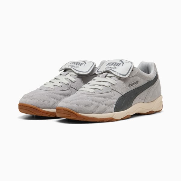 Grey PUMA King men's trainers with a dark grey stripe and light brown sole.