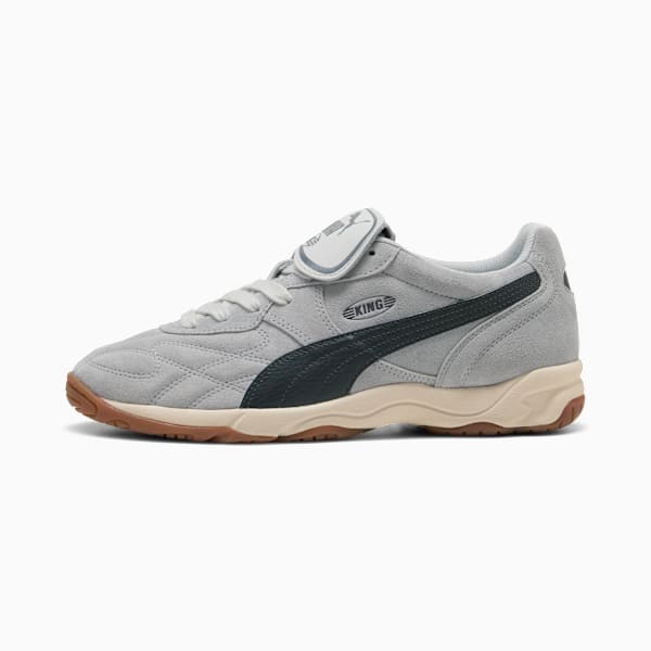 Grey PUMA trainers with a dark stripe, a padded tongue and a textured sole.