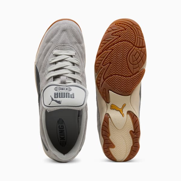 Grey PUMA King men's trainer with lace-up closure and patterned rubber sole.