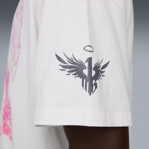 Close-up of a white t-shirt sleeve with a winged logo and pink design.