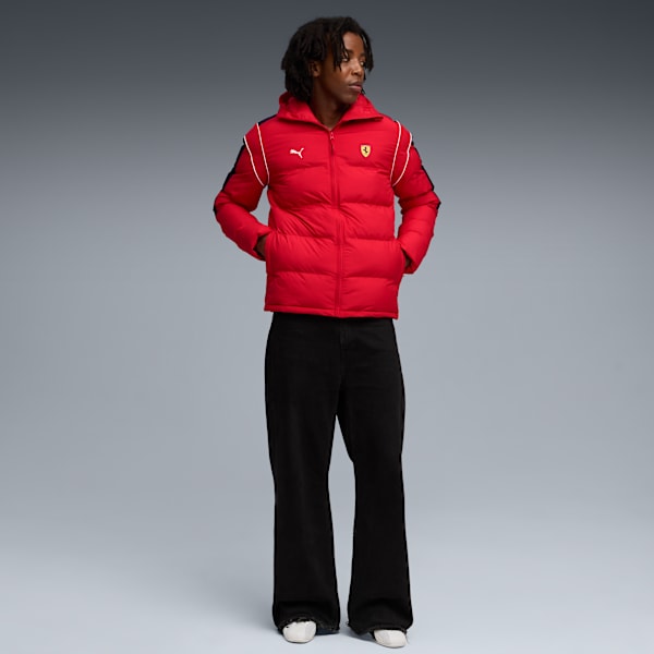 Against grey, a model poses wearing a red padded jacket and black wide-leg trousers.